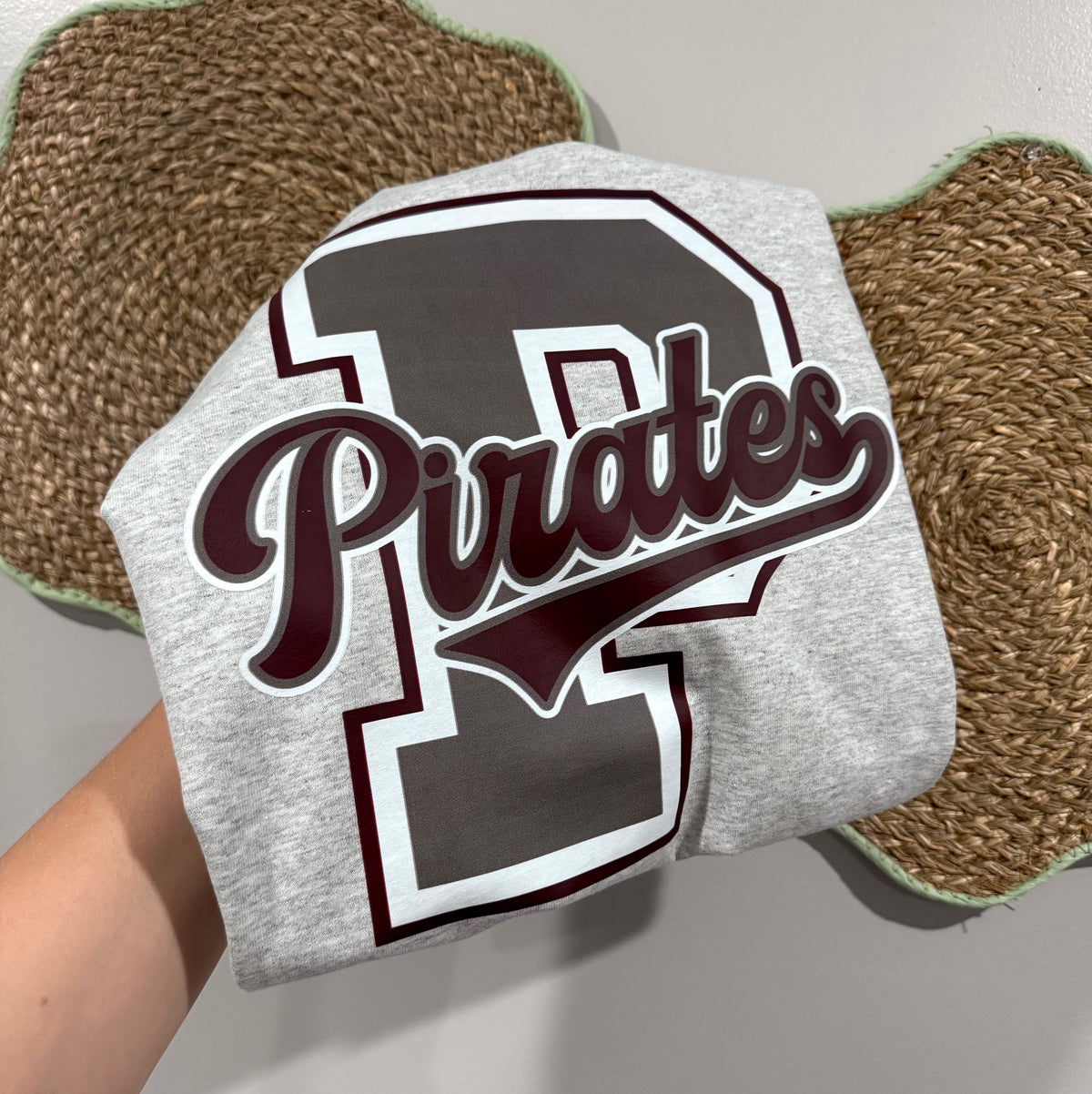 Varsity school letter with mascot across